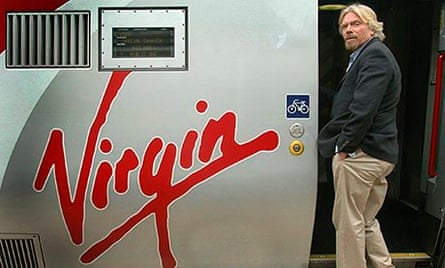 Sir Richard Branson boarding a Virgin train