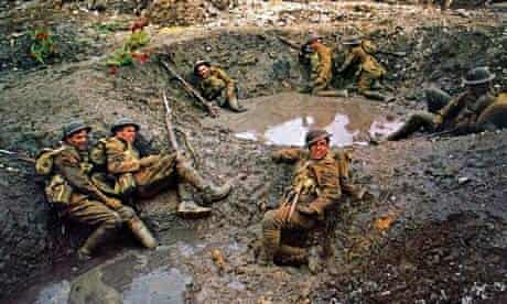 Soldiers in muddy, flooded shell holes in scene from the 1969 film Oh What a Lovely War