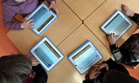Future education: children use tablets at a nursery.