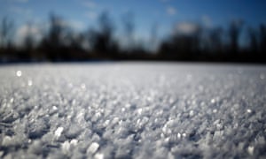 Icy crystals gather on top of a frozen pond in Lawrenceburg, Kentucky.