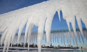 The Chicago skyline framed by icicles in Illinois.