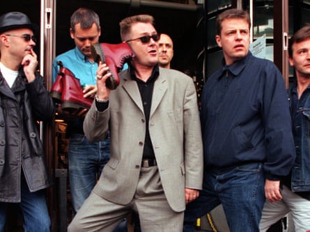 Madness in 1999, with Cathal Smyth to the left and front of Suggs.