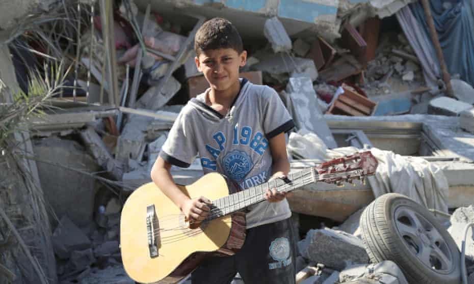 Mahmoud, 10: "I like to play the guitar because music takes you away from life."