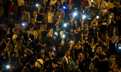 Demonstrators hold up their mobile phones to form a 'sea of lights' in Admirality, as part of a pro-democracy sit-in known as 'Occupy Central', blocking traffic on Gloucester Road, an otherwise busy multi-lane thoroughfare in Hong Kong, on October 1, 2014.