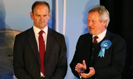 Conservative candidate Giles Watling applauds as Ukip's Douglas Carswell is named the winner in the Clacton byelection.