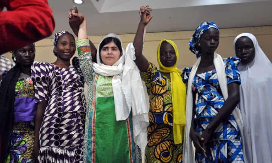 Malala Yousafzai poses with five Nigerian girls, who escaped after being abducted from their Chibok school by Boko Haram.  (LtoR) Rebecca Ishaku, Kanna Bitrus, Hauwa John, Hauwa Musa and Hawa Alhl'ama