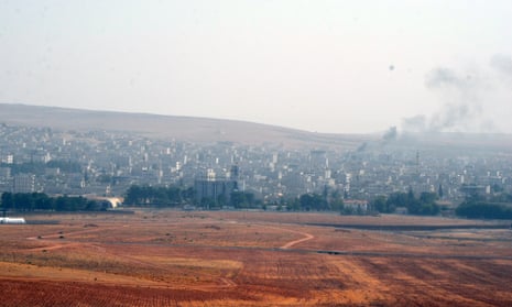 Smoke rises from Kobani as reports emerge that Isis terrorists are defeating the Kurdish militia defending the city.