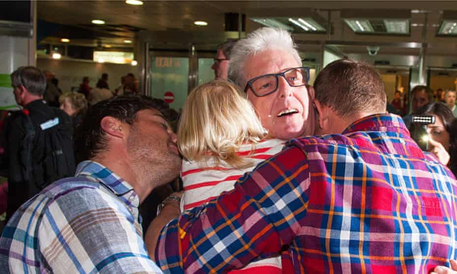 Ray Coles is greeted by his family at Gatwick airport after being released from jail in Morocco