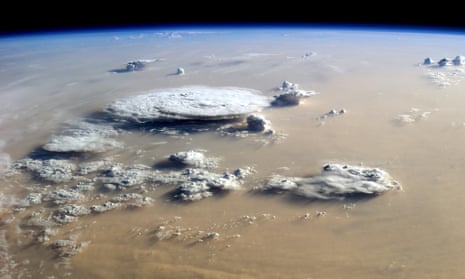 Dust and Clouds Dance Over the Sahara