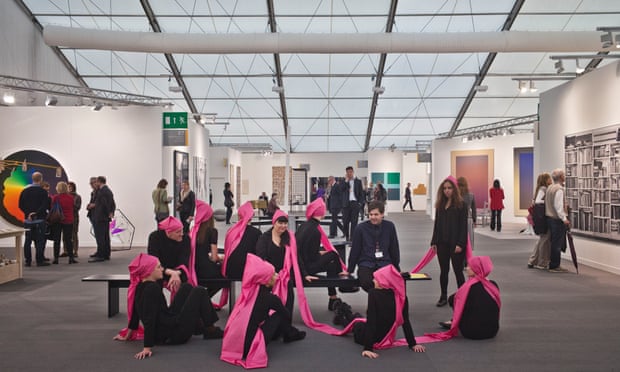 frieze ten people one hat pink ribbons