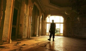 A rebel soldier inside one of Mobutu's palaces in Gbadolite – in its heyday the jungle town hosted lavish parties.