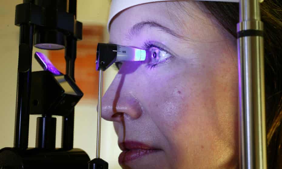 A woman undergoes an eye examination