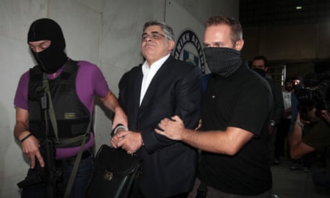 Golden Dawn leader Nikos Michaloliakos is escorted by anti-terror police in Athens
