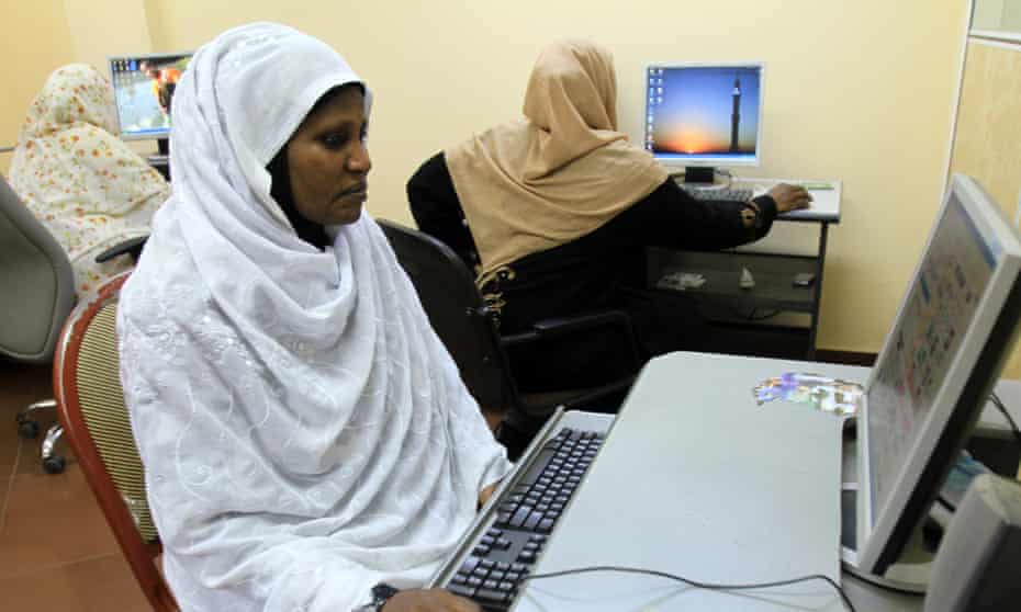 Sudanese women browse the internet at an office in Khartoum