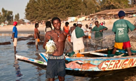 Fisherman at Kololi beach in the Gambia. Hoteliers in the area are concerned that Ebola fears are de