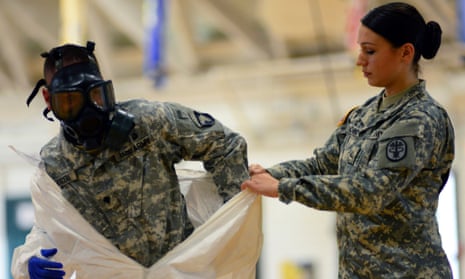 Pfc Kaiya Capuchino from US Army Medical Research Institute of Infectious Diseases trains US Army soldiers from the 101st Airborne Division who are earmarked for the fight against Ebola.