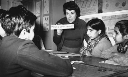 A teacher giving English lessons to immigrant children from India and Pakistan at a school in Walsall, Staffordshire, in 1969.