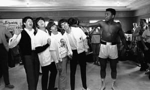 Clay poses with The Beatles who were in New York in 1964 for an appearance on the The Ed Sullivan Show. Clay was preparing for his world heavyweight title fight with Sonny Liston.