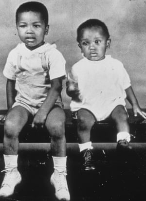 A young Cassius Clay is pictured (left) with his younger brother.