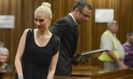 Oscar Pistorius makes his way past his ex-girlfriend Samantha Taylor as he arrives in the Pretoria high court.