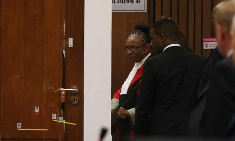 Judge Thokozile Masipa examines the toilet cubicle during Tom Wolmarans' testimony on 9 May.