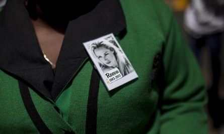 A member of the ANC Women's league wears a pin for Reeva Steenkamp.