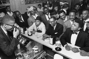 Clay celebrates with Malcolm X. Rumours had already circulated that Clay had joined the National of Islam religious movement, and he finally declared them to be true the day after beating Liston.