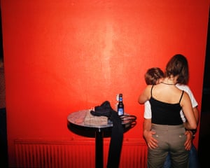 A young couple kiss  in a Newquay nightclub, July 2001.