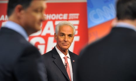 Democratic candidate Charlie Crist, center, waits for a question before his live debate with Republican governor Rick Scott on Tuesday.