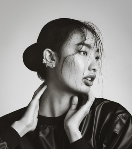A model with a constellation of ear piercings