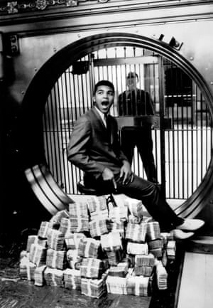 The version of this photograph which made the cover of Sports Illustrated was shot by Richard Meek. But I prefer this picture, taken shortly beforehand, by Ali’s friend Howard Bingham. It’s just a little more fun. And I like how the security guard is there in the background keeping tabs.