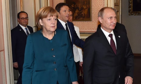 German Chancellor Angela Merkel (left), Russian President Vladimir Putin (right), Italian Prime Minister Matteo Renzi (centre) and French and President Francois Hollande (back) on the sidelines of the EU-Asem summit in Milan, northern Italy, on 17 October 2014.  EPA/Daniel Dal Zennaro