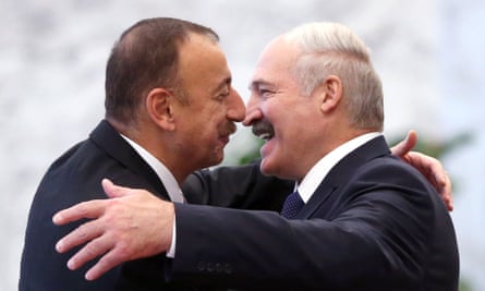 Azeri President Ilham Aliyev (left) greets Belarusian President Alexander Lukashenko (right) during the Summit of the Commonwealth of Independent States (CIS) in Minsk on 10 October, 2014 in Minsk, Belarus.