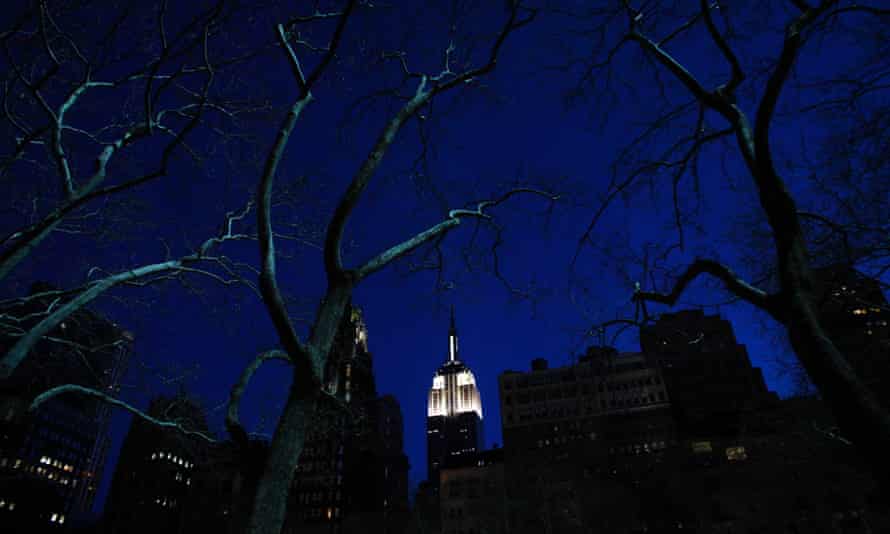 The Empire State Building is seen lit up before Earth Hour in New York, during which lights were turned off for one hour to show support for renewable energy.