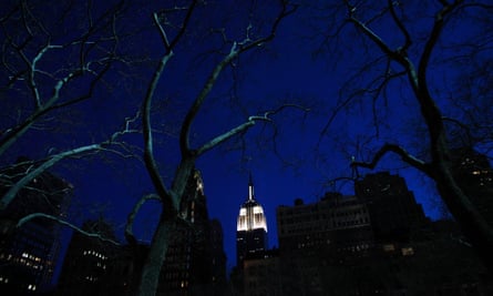 The Empire State Building is seen lit up before Earth Hour in New York, during which lights were turned off for one hour to show support for renewable energy.