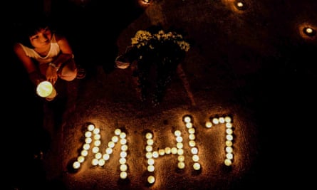 Malaysians hold a candlelight vigil for passengers and crew of crashed flight MH17 in Kuala Lumpur.