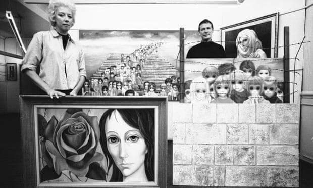 Margaret and Walter pose with a selection of paintings in 1965.