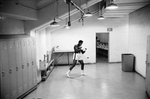 This shot witnesses a scene, pre-fight, where Ali is poised with anticipation. His outline is so distinctive – it reminds me of the famed image of Ali underwater by Flip Schulke. Notice, also, the shadowy figure in the toilet behind Ali; at first I questioned whether he spoiled Ali’s solitude, but I grew to like the subtle detail of their twinning.