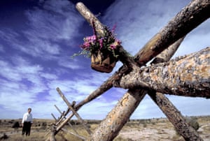 A basket of flowers hangs from the fence where Matthew Shepard was left tied and beaten