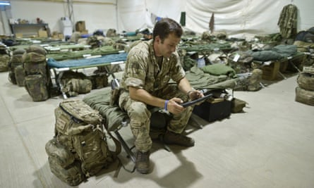 Staff Sergent Craig Worsley, 34, of 1st The Queen's Dragoon Guards, sitting inside temporary tented accommodation at Camp Bastion as troops prepare to withdraw and return to the UK.