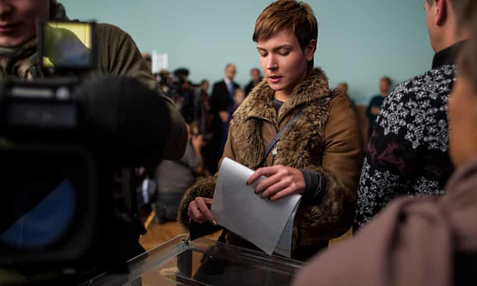 A young Ukrainian woman casts her ballot in Kiev, 26 October 2014