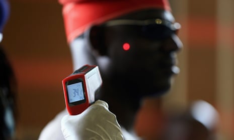 Man's temperature taken in Nigeria for Ebola screening