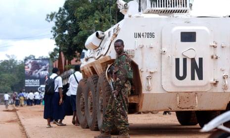 A soldier beside a UN armoured vehicle in Beni, Democratic Republic of Congo.