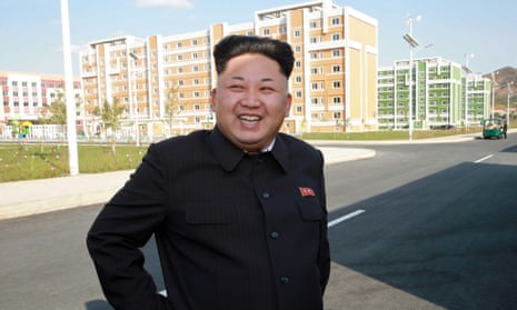North Korean leader Kim Jong-un smiling as he inspects a newly-built housing complex in Pyongyang.