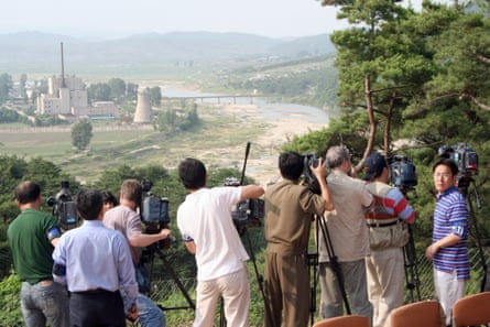 Foreign TV crews prepare to shoot the demolition of the Yongbyon nuclear complex’s cooling tower, in June 2008.