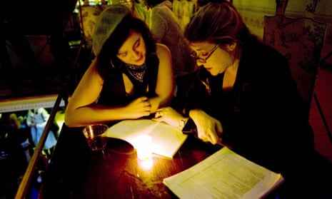 A poetry reading between two women at the Poetry Brothel in New York.