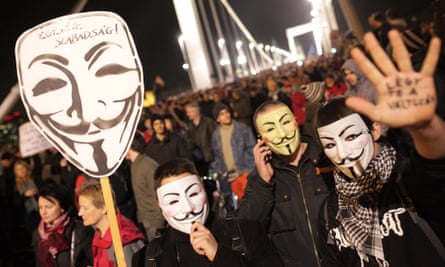 Protesters don masks during demonstrations against the proposed internet tax.