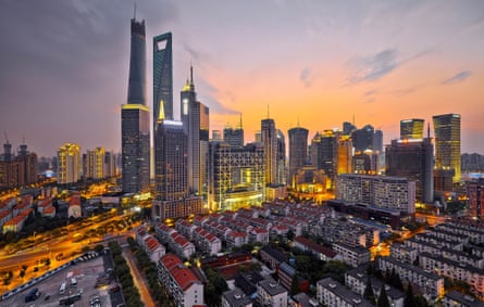 The Shanghai Tower (tallest building, left) under construction.
