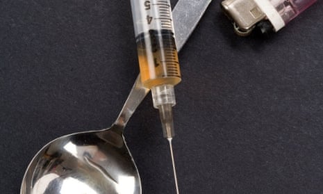 heroin Syringe, spoon and lighter, concept of addiction
