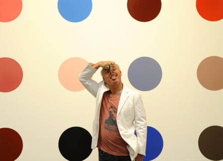 Artist Damien Hirst stands in front of one of "Minoxidil,2005"